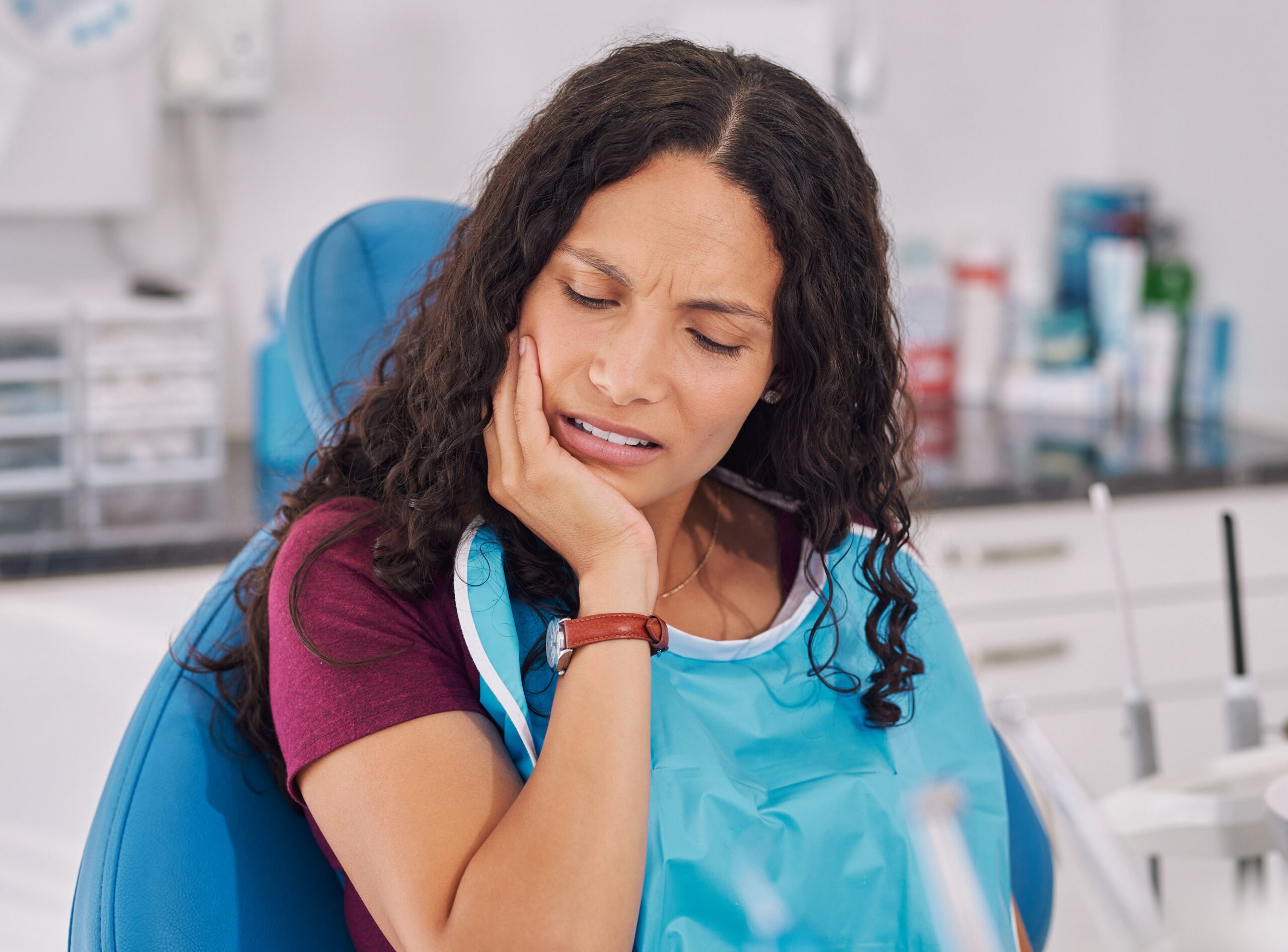 Young multiethnic woman suffering from toothache