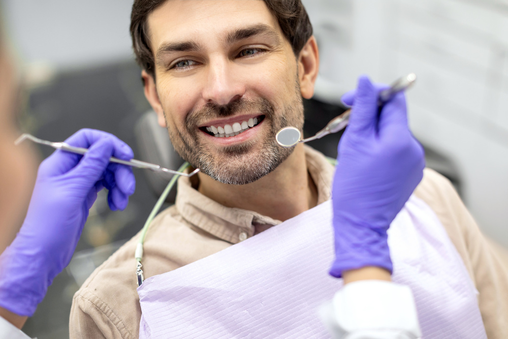 Dentist performing a routine dental checkup on a patient